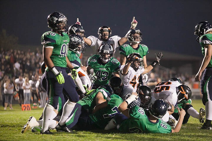 &lt;p&gt;Patrick Cote/Daily Inter Lake Flathead scores a touchdown Friday night during the sixth crosstown matchup at Legends Stadium. Friday, Sept. 28, 2012 in Kalispell, Montana.&lt;/p&gt;