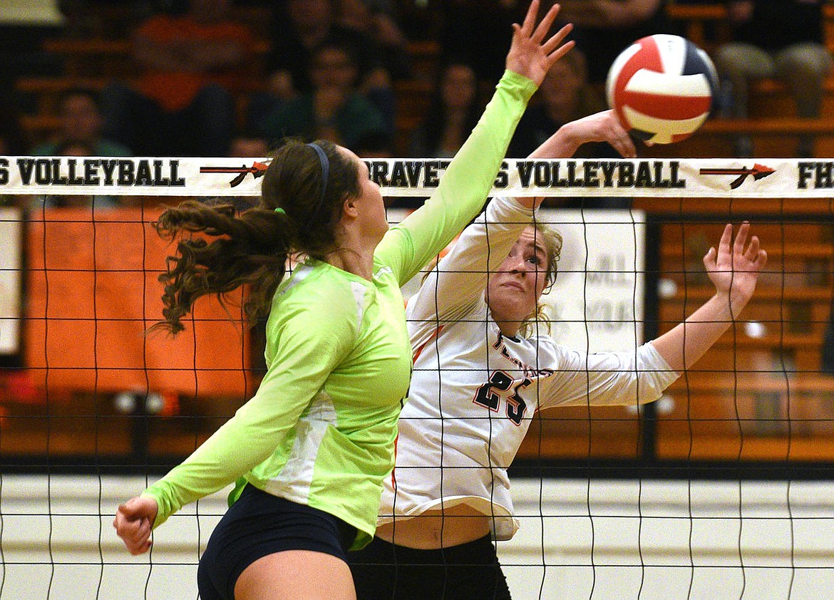 &lt;p&gt;Flathead hitter Allie Gagnon tips the ball past Glacier hitter Abi Fiske during the second game at Flathead on Thursday. (Aaric Bryan/Daily Inter Lake)&lt;/p&gt;