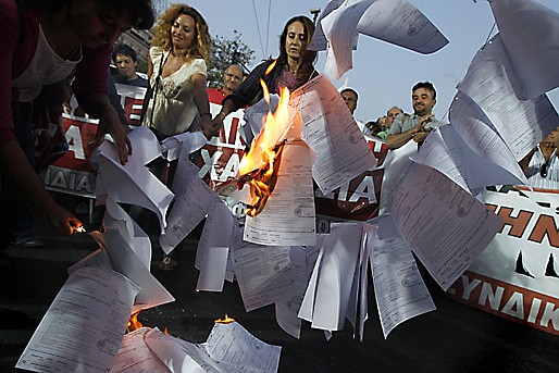 &lt;p&gt;Demonstrators burn copies of emergency tax notices during a protest by the Communist-backed labor union on Wednesday, Sept. 28, 2011. Greece's Socialist government is facing a new wave of protests, amid pressure from international rescue creditors to abide by its cost-cutting targets. EU and IMF debt inspectors are due to visit Athens Thursday to review the Greek finance program. (AP Photo/Petros Giannakouris)&lt;/p&gt;