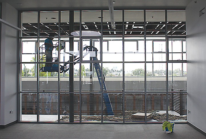 A worker puts some final touches on the inside of the Moses Lake
Civic Center. The building should be complete in mid-October,
according to city officials.