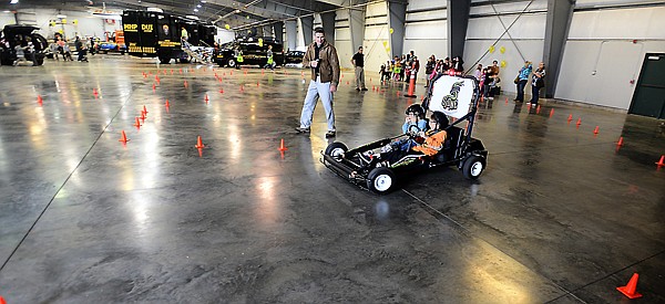 &lt;p&gt;Dominic Pattee, 6, in blue, and his brother Dylan Pattee, 9, both of Marion, ride the Simulated Impaired Driving Experience car at the Flathead Family Fun Day &amp; Safety Expo on Saturday, September 28, at the fairgrounds in Kalispell. The ride allows drivers to take circle the course two times, first under normal driving conditions, then with a second and a half delay. It lets the driver feel the effects of even a small amount of time delay at six to seven miles per hour and lets them imagine the effect at 70 miles per hour. Having the car at the Safety Expo encourages children to tell their parents not to text and drive. (Brenda Ahearn/Daily Inter Lake)&lt;/p&gt;