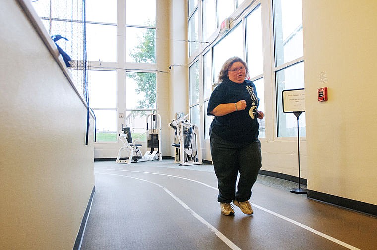 &lt;p&gt;Chrissy Siefke jogs around the track Tuesday morning at The Summit in Kalispell. Every day she runs a half mile as part of her training.&lt;/p&gt;