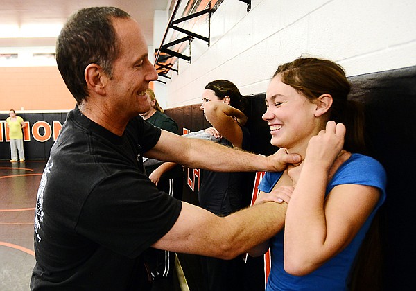 &lt;p&gt;Corbett works with Flathead junior Sierra Rivera during a self-defense class. Corbett taught girls the basics of Brazilian jiu-jitsu.&lt;/p&gt;