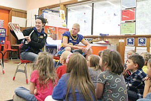 &lt;p&gt;Senior Hailey Craig reading &quot;Too Many Toys&quot; Monday to Mrs. Foss's first-grade class with sophomore Brandon Sadewasser. Afterward there was a question and answer period where first-graders were able to ask what it was like to be in high school.&lt;/p&gt;