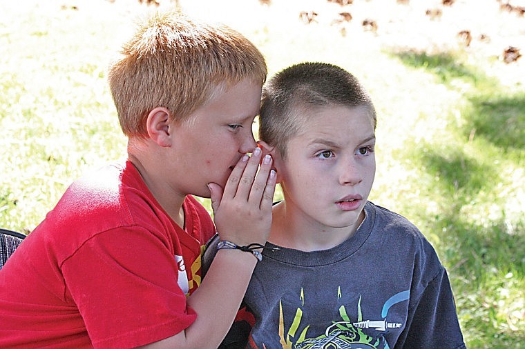 &lt;p&gt;Connor Burke and Uriah Christiensen, St. Ignatius third graders,
share strategy during an intense stick game at the People's Center
Thursday during Native American Awareness Week festivities.&lt;/p&gt;