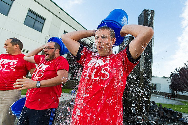 &lt;p&gt;SHAWN GUST/Press&lt;/p&gt;&lt;p&gt;Mike Varga, director of pharmacy for Northwest Specialty Hospital, right, pours a bucket of ice water over his head following the lead his colleagues Chris Gregg, payroll coordinator, second from left, and accountant Brian Brigham as part of the ALS ice bucket challenge Monday at the Post Falls medical facility.&lt;/p&gt;