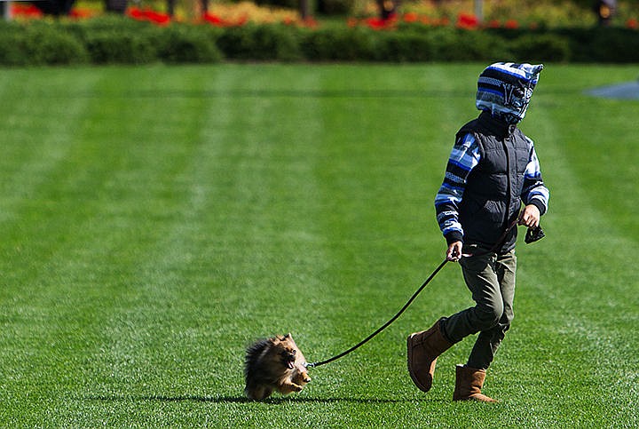 &lt;p&gt;TESS FREEMAN/Press&lt;/p&gt;&lt;p&gt;Morgan Williams, 10, plays with his dog Sochi on the lawn in front of the Coeur d&#146;Alene Resort on Tuesday morning.&lt;/p&gt;