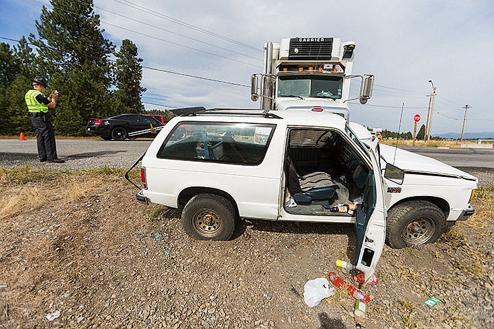 &lt;p&gt;SHAWN GUST/Press&lt;/p&gt;&lt;p&gt;Idaho State Patrol trooper Justin Scotch photographs the details of a crash near the intersection of Highway 53 and Pleasant View Road after responding to the scene where a Spokane Produce truck collided with a small SUV. Both drivers were transported to Kootenai Health with injuries. The crash is under investigation.&lt;/p&gt;