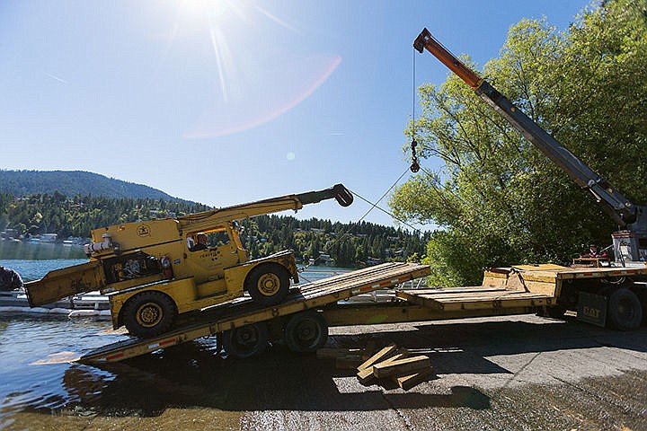 &lt;p&gt;SHAWN GUST/Press&lt;/p&gt;&lt;p&gt;A mobile crane is loaded onto a trailer after accidentally slipping off a barge while North Idaho Maritime workers were transferring the crane onto a truck Thursday morning at the Honeysuckle Beach boat ramp. According to Hayden Planning Director Sean Hoisington the barge shifted backwards during the transfer and the front axle slipped off the truck into the water. A small amount of hydraulic fluid leaked into the lake, but Hoisington said most of that was contained with hazmat absorbent booms and the Department of Environmental Quality was alerted to the spill.&lt;/p&gt;