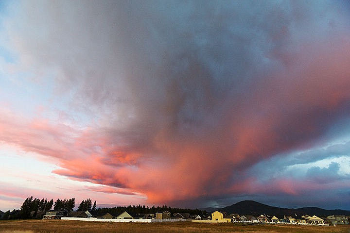 &lt;p&gt;SHAWN GUST/Press&lt;/p&gt;&lt;p&gt;The setting sun splashes color onto storm clouds over a neighborhood in Coeur d&#146;Alene on Tuesday evening.&lt;/p&gt;