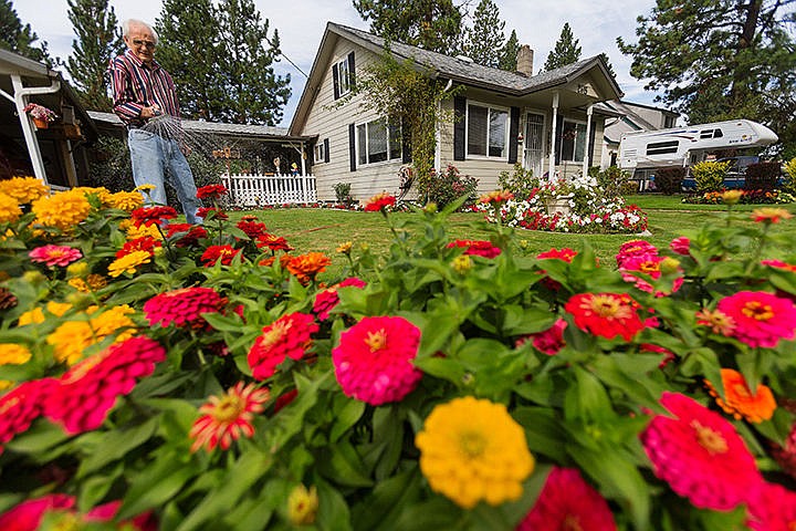 &lt;p&gt;SHAWN GUST/Press&lt;/p&gt;&lt;p&gt;Jerry Sorbel, 83, waters a flower bed Monday in the front yard of his Coeur d&#146;Alene home. Sorbel, who has lived in his home since 1955, has been gardening for decades and currently has several hundred flowers on his property.&lt;/p&gt;