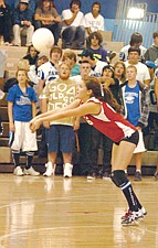 Mission senior libero Mackenzie Trudeau gets one of her digs against Plains last Thursday night.