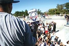 Eager kids hope to catch some of the free gear professional snowboarder Marc Frank Montoya throws out during last Saturday's Skate Ignatius Skate Jam. The event marked the official opening of Phase II of the park, which organizer Kristie Nerby deemed a great success.