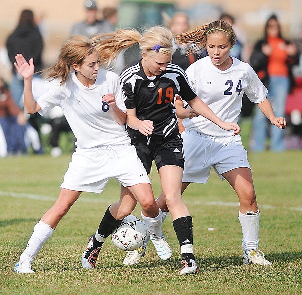 &lt;p&gt;Flathead sophomore&#160; Paige Birky (19) fights to keep possession
of the ball with Glacier defenders Morgan Meier (8) and Abbe
Breeding (24) during the crosstown&lt;/p&gt;&lt;p&gt;soccer match on Saturday at Glacier. Flathead won, 2-0.&lt;/p&gt;