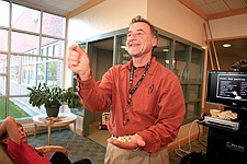 Dr. Michael Righetti, orthopedic surgeon and backcountry horse riding enthusiast led the wilderness first aid seminar at St. Joseph's Medical Center Sept. 15. Righetti shows the audience each of his many-colored pills, which he keeps in one bottle in his first aid kit. The trick, he says while laughing, is to remember what they all do when you need them.