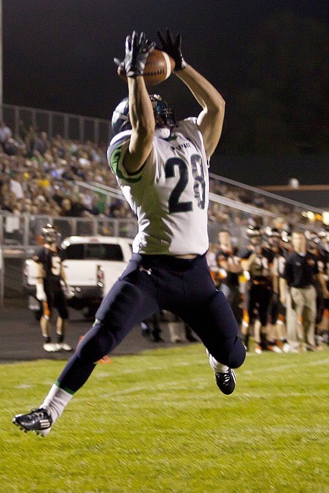 <p>Glaciers Aaron Mitchell (28) hauls in a two-point conversion
pass after a touchdown in Friday nights crosstown football game at
Legends Stadium.</p>