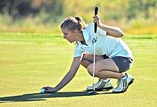 Polson junior Katharina Medland lines up a shot during the Northwestern A Divisionals last Saturday in Ronan.