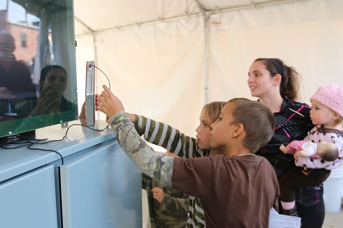 &lt;p&gt;A pair of youngsters checks out a demonstration panel during a public unveiling of the Solar Roadways panel. Unfortunately, a production delay canceled the demonstration portion of the event. That has been rescheduled for 1 p.m. today at Jeff Jones Town Square.&lt;/p&gt;