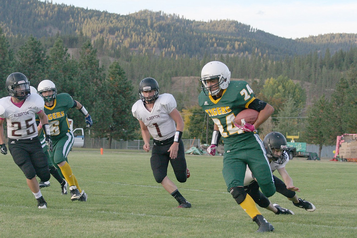 &lt;p&gt;The St. Regis Tigers rush the ball against Alberton earlier in the season.&lt;/p&gt;