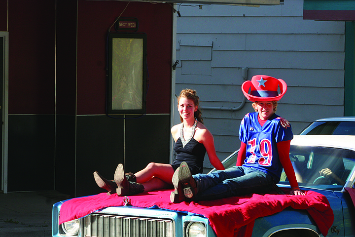 Dahkota Hayes and Tanner Coon ride in the homecoming parade on Friday before the game against the Cut Bank Timberwolves.