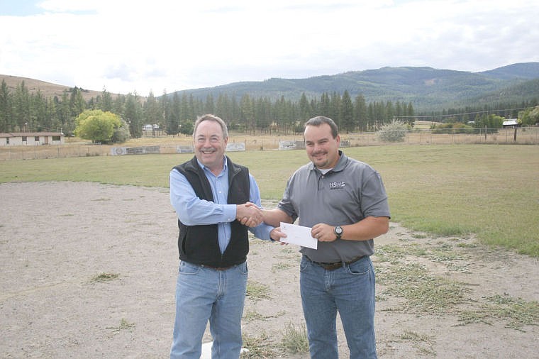 &lt;p&gt;David Greer presents Hot Springs Athletic Director Chris Clairmont with the check from Plum Creek.&lt;/p&gt;