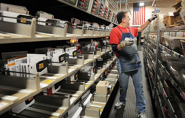 &lt;p&gt;Lance Arave of Evergreen removes letters from the sorting machine on Dec. 15, 2010, at the Meridian Road Post Office in Kalispell. Sorting operations are being shifted to Missoula by the U.S. Postal Service.&lt;/p&gt;