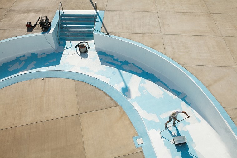 &lt;p&gt;Richard Fischer of Triton Construction uses a roller Wednesday afternoon to apply epoxy to the bottom of the Lazy River pool at Woodland Waterpark in Kalispell as part of the routine maintenance before winter hits.&lt;/p&gt;