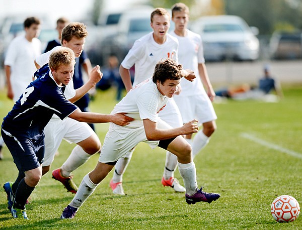 &lt;p&gt;Glacier senior forward Matt Peters (left) battles Flathead freshman Justin Gardner&#160; during Saturday&#146;s crosstown match at the Kidsports Complex.&lt;/p&gt;