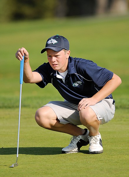 Glacier's Ryan Porch prepares to make a putt during day one of the Class AA state tournament on Friday at Buffalo Hills Golf Course in Kalispell.