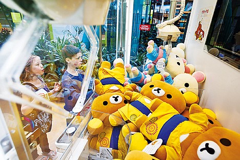 &lt;p&gt;Bella Irvin, 8, reacts as her brother Avery wins a bear in a crane machine at the Mall of America. The coin-operated games are among Avery's various temporary obsessions.&lt;/p&gt;