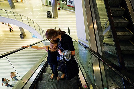 &lt;p&gt;Ellie Irvin consoles her daughter Bella, 8, exhausted after exploring the 4.2 million square-foot Mall of America for the third consecutive day.&lt;/p&gt;