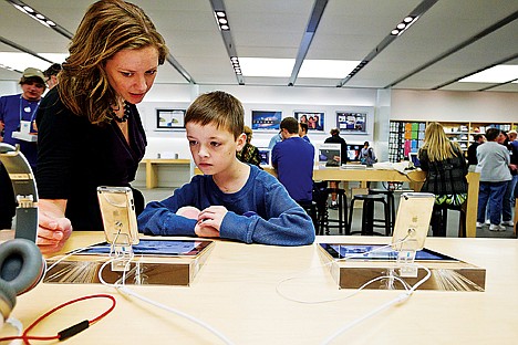 &lt;p&gt;Avery Irvin checks out an iPod Touch with his mother Ellie as part of his shopping spree at Mall of America. The device was his big purchase choice as well as his sister's choice. Irvin split his shopping funds with his younger sister.&lt;/p&gt;