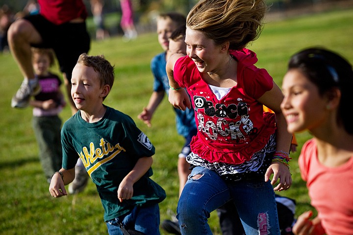 &lt;p&gt;SHAWN GUST/Press Crystal Hoard, a fifth-grader at Ponderosa Elementary School, leaps into the air Tuesday with class mates Brandon Shaw and Idamae Grahlman, far right, during a high-knees running drill. The Post Falls High School cross country team hosted their annual running clinic for hundreds of elementary students throughout Post Falls.&lt;/p&gt;