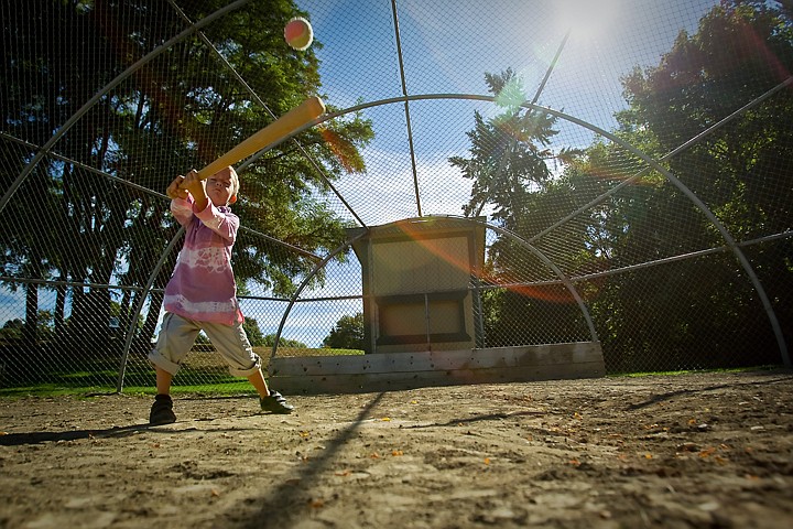 &lt;p&gt;JEROME A. POLLOS/Press Jaden Francis, 5, closes his eyes and swings away while playing baseball with his father, Chris, during an outing Monday at McEuen Park in downtown Coeur d'Alene.&lt;/p&gt;