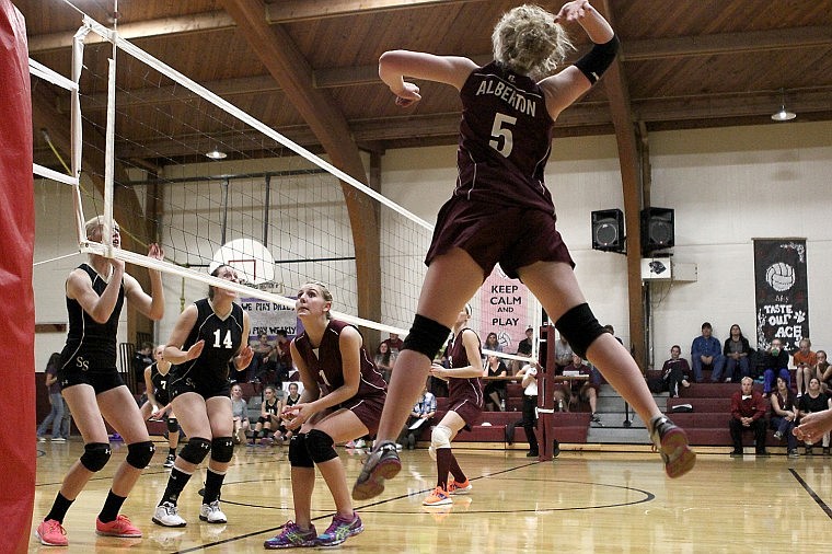 &lt;p&gt;Junior Delani Hanley elevates to grab one of her 11 kills against Seeley-Swan.&lt;/p&gt;