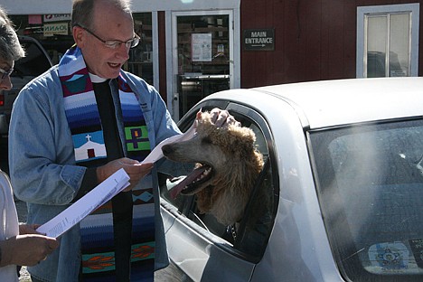 &lt;p&gt;Father Pat Bell blesses Nemo, a poodle, at the Kootenai Humane Society Thrift Store Blessing of the Animals on Saturday.&lt;/p&gt;