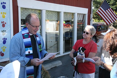 &lt;p&gt;Father Pat Bell performs a blessing as Joyce Lovey, right, and her Boston terrier, Patti, look on Saturday at the Kootenai Humane Society Thrift Store Blessing of the Animals.&lt;/p&gt;