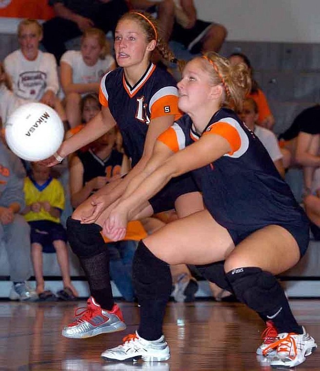 Flathead senior Brandi Boreson digs the ball while teammate Cricket Johnston looks on during Flathead's loss to Helena Capital &lt;br&gt;Saturday at the FHS gym. Chris Jordan/Daily Inter Lake