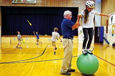 &lt;p&gt;David Groth, a teacher at Sorensen Magnet School of the Arts and Humanities, helps Valkyrie Leachman, 10, balance on a ball during a class session Thursday. Groth is one of four artists who will be awarded a Coeur d'Alene Mayor's Awards in the Arts next week.&lt;/p&gt;