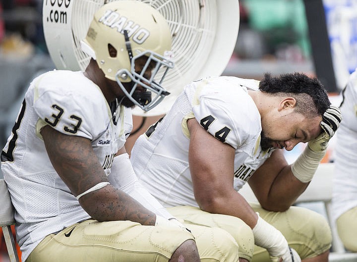 &lt;p&gt;Idaho's Tueni Lupeamanu, right, reacts to a 56-6 Vandals loss against Washington State University on Saturday in Pullman.&lt;/p&gt;