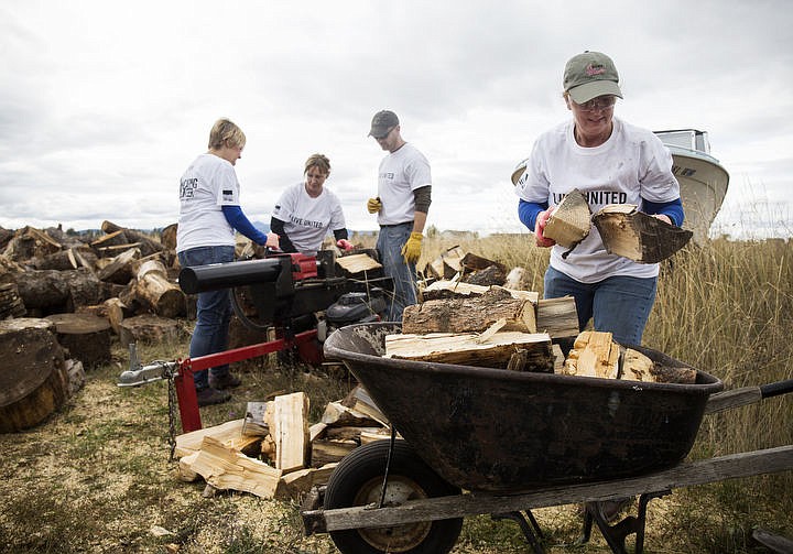 &lt;p&gt;Hecla Mining administration assistant Dawn Nolan, far right, places logs into a wheelbarrow as fellow co-workers Cathy Schaefer, left, Kimberly Millikan and Jaso Heidt volunteer their time to United Way by splitting logs on Sept. 22, 2016 for Day of Caring. Over 500 cords will be delivered to the elderly in need.&lt;/p&gt;