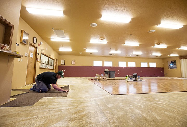 &lt;p&gt;Joe Hartley with Fairway Floors lays new carpet tiles inside the main room of the Post Falls Senior Center on Wednesday, Sept. 14, 2016.&#160;&lt;/p&gt;