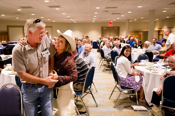 &lt;p&gt;Coeur d'Alene Rotary Club President Heidi Rogers square-dances with Luke Russell at the Club's kick-off meeting Friday, Sept. 16, 2016 for its annual rose sale.&lt;/p&gt;