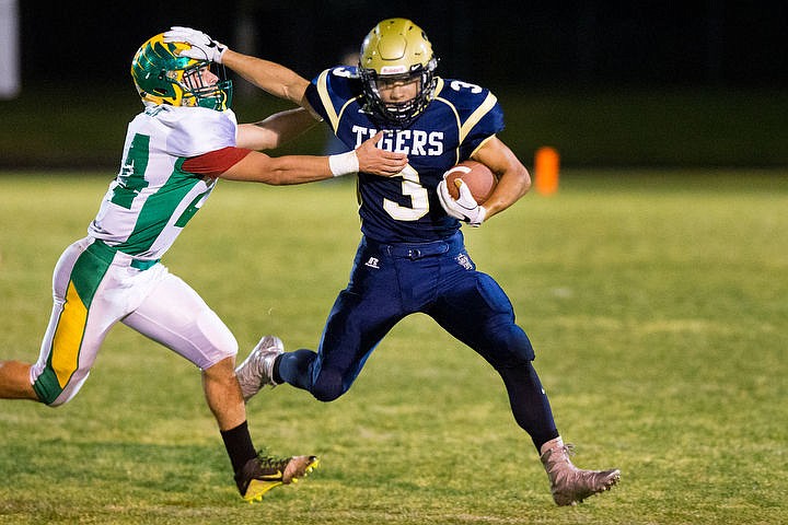 &lt;p&gt;Timberlake runningback Bailey Houston stiff arms Wyatt Gatten of Lakeland on Friday, Sept. 30, 2016 at Timberlake High School.&lt;/p&gt;