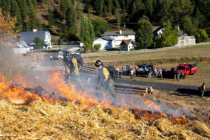 &lt;p&gt;Firefighters with the Idaho Department of Lands work the fireline of a mock fire Thursday, Sept. 15, 2016 as attendees of the Miracle at Work Forest Tour watch below at the Edgewater Creek Tree Farm. The demonstration illustrated how firefighters tackle forest fires.&lt;/p&gt;