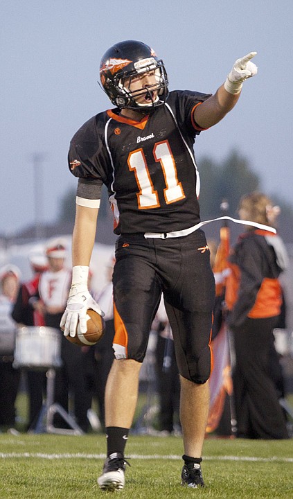 <p>Flathead senior wide receiver George Sherwood (11) points to the
crowd after scoring a touchdown Friday night.</p>