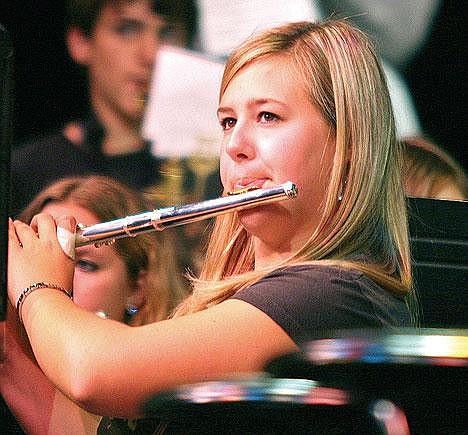 Libby High School flutist Margeaux Zwang practices with Dallas Brass at the Memorial Center on Monday. One of the nation's foremost and internationally acclaimed musical ensembles, the group worked with students from Troy, Libby and Eureka before performing for the public later that evening. (Photo by Paul Sievers)