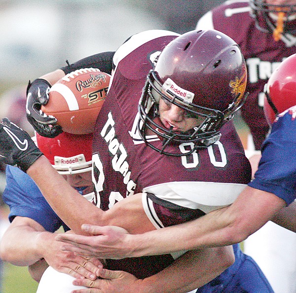 Troy&#146;s Kody Hoffman bulls ahead for a first down in the first quarter against Superior.