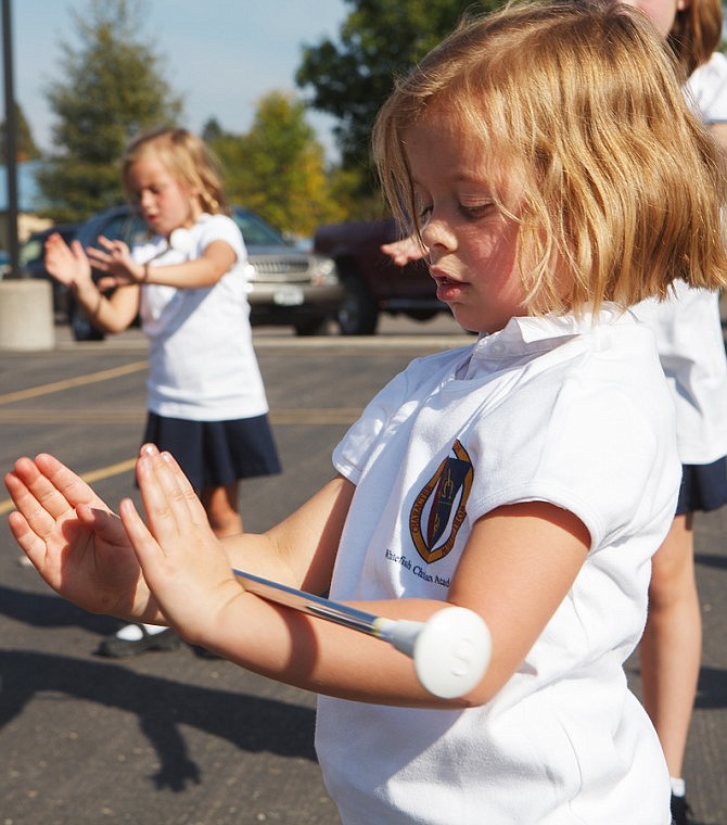 &lt;p&gt;Patrick Cote/Daily Inter Lake Pre-K student Caroline Owens practices the &quot;Roly-Poly&quot; move Thursday afternoon during the first ever baton twirling class at Whitefish Christian Academy. Thursday, Sept. 20, 2012 in Whitefish, Montana.&lt;/p&gt;