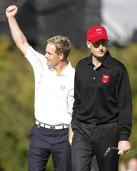 &lt;p&gt;Europe's Luke Donald, left, and Jim Furyk of the U.S. react after Donald won their match on Monday, the final day of the 2010 Ryder Cup at the Celtic Manor Resort in Newport, Wales.&lt;/p&gt;